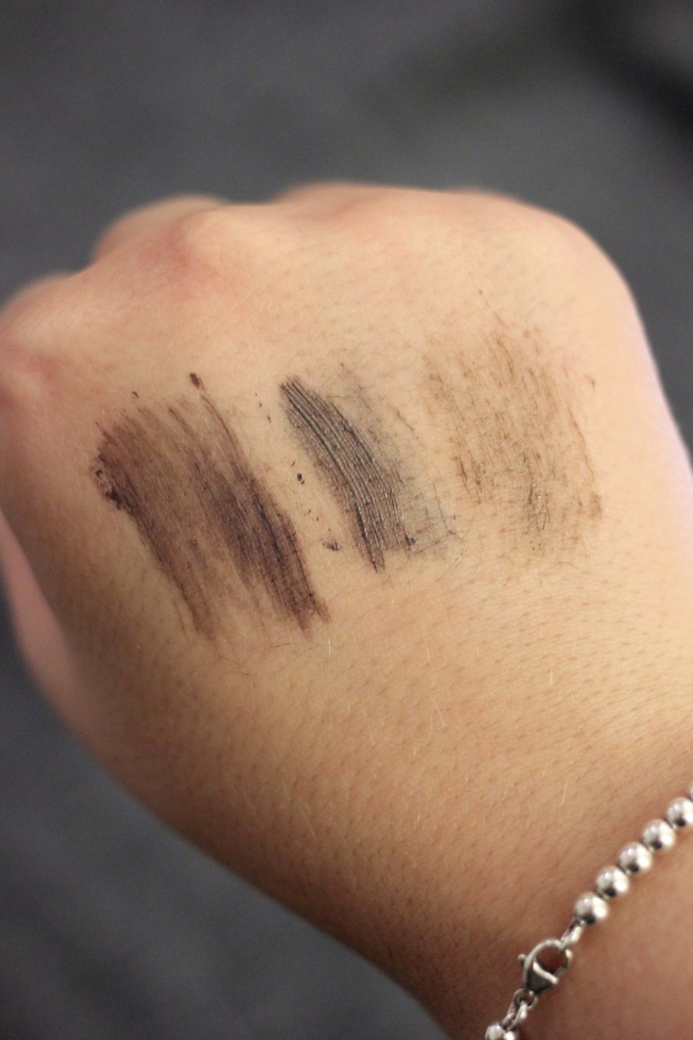 Swatches, left to right, Rimmel Brow This Way, Benefit Gimme Brow, Maybelline Brow Drama.